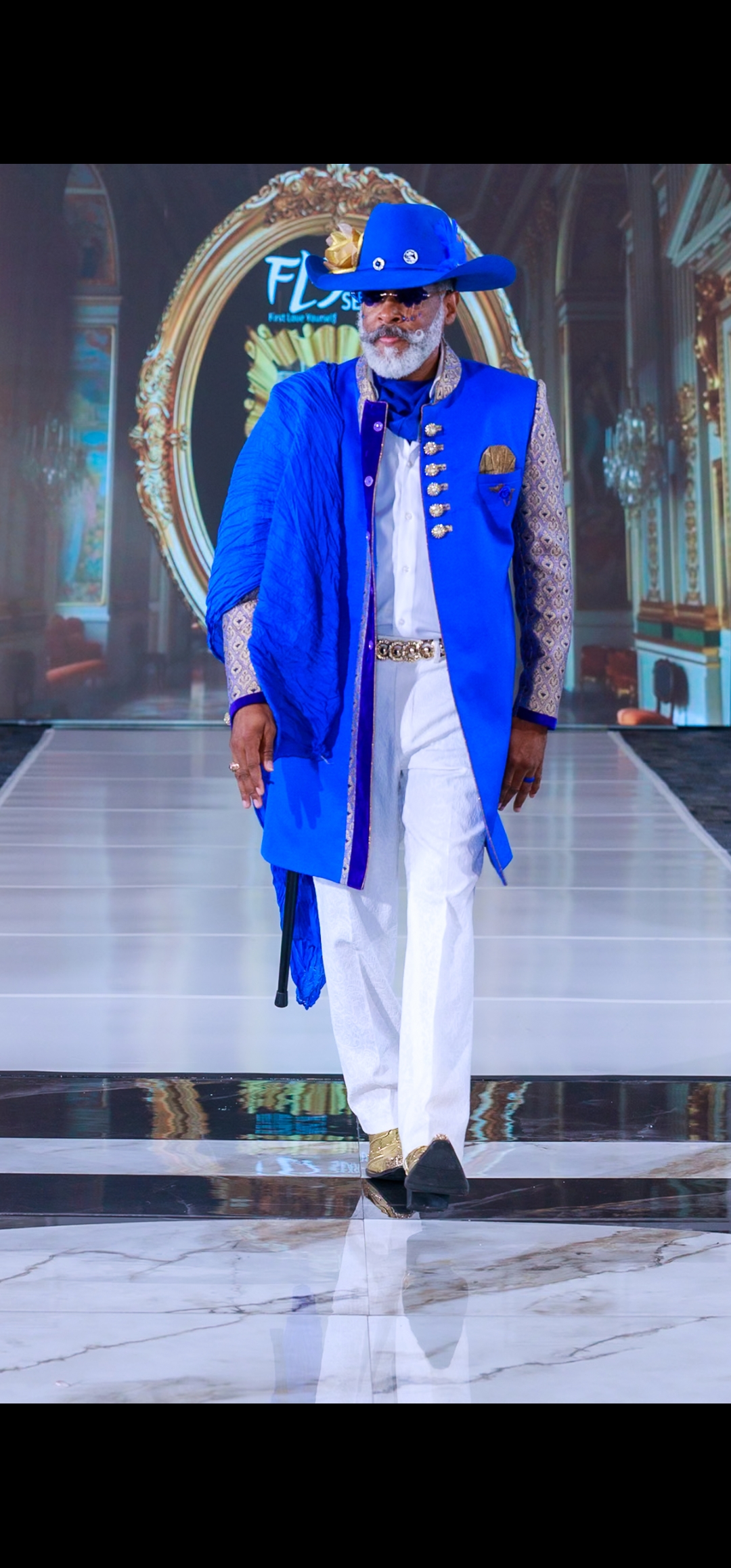 View all photos from this look Runway — royal blue Western GQ look; opens gallery of photos from this look